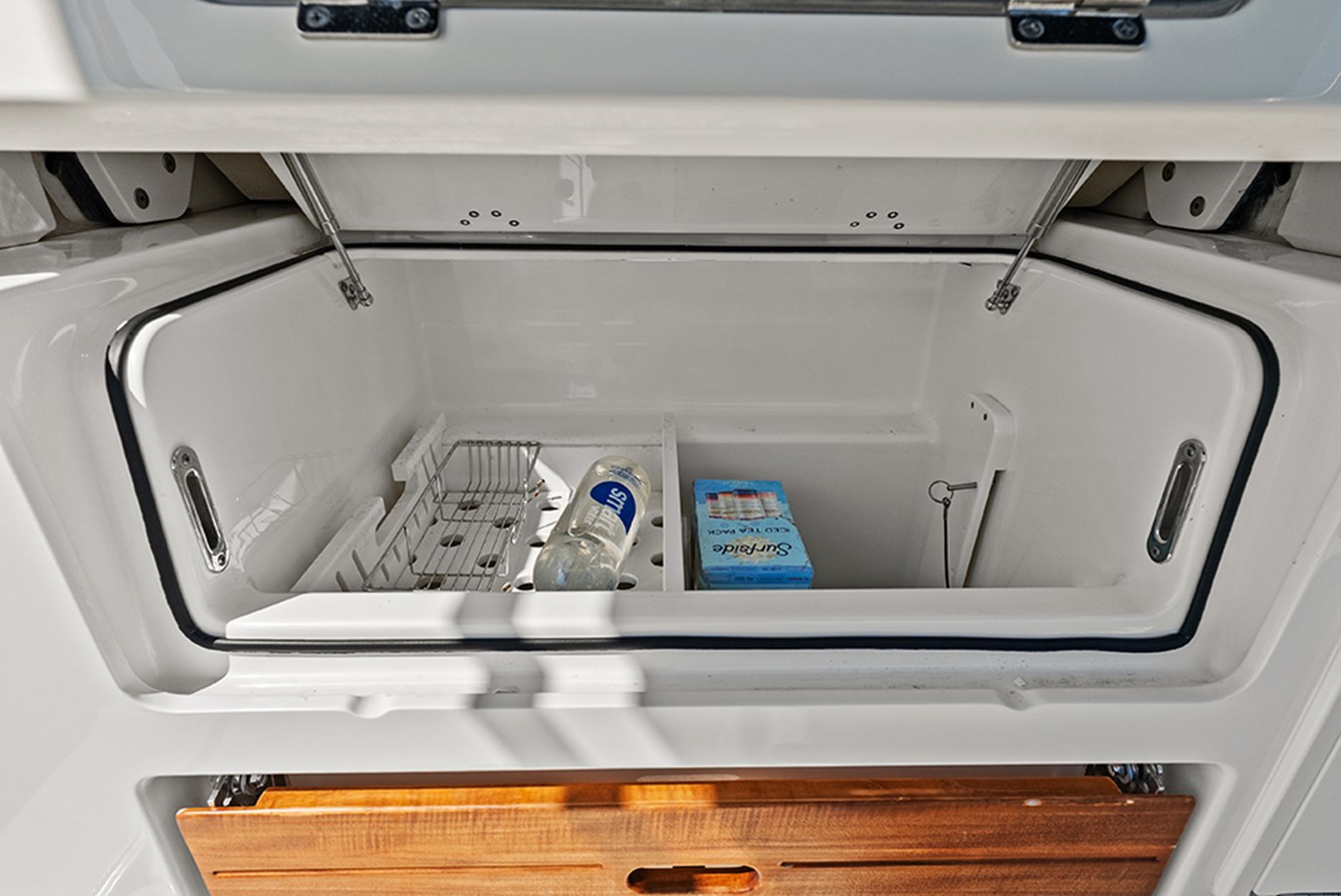 Insulated built-in cooler/storage under second row seating