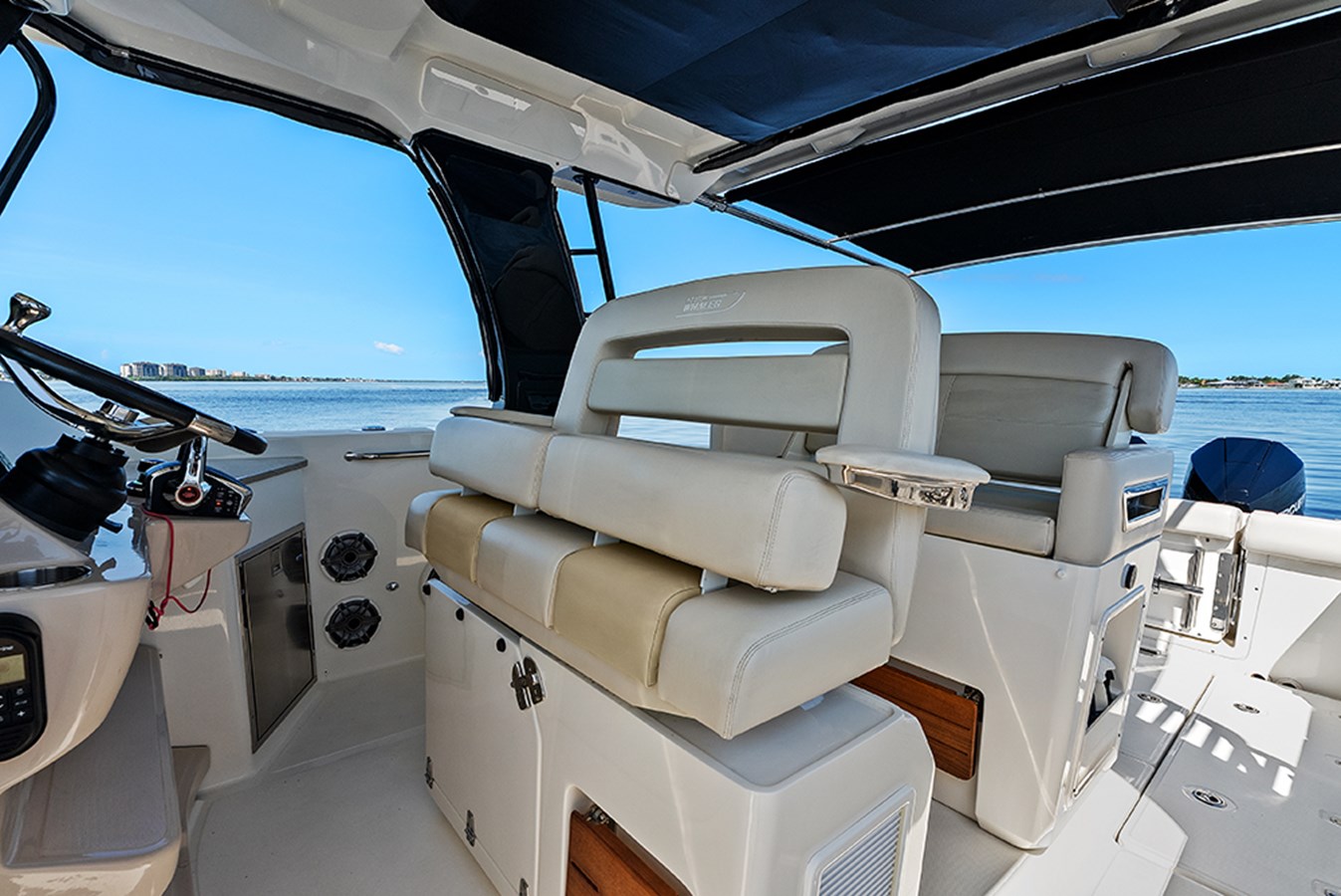 Flip-up rotating helm seat