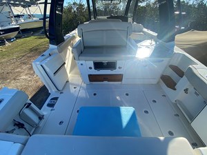 UNPLUGGED 7 2023 Boston Whaler 350 Realm boat interior with seating and storage compartments.