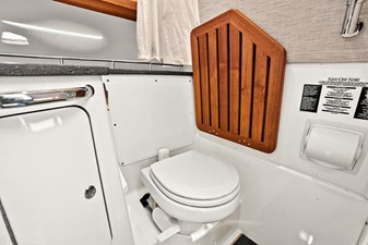 UNPLUGGED 38 Head with solid teak flip up seat over toilet
