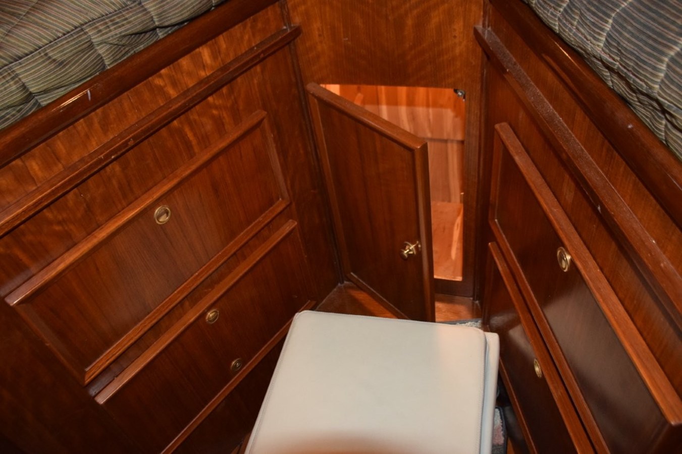 Drawer and cabinet storage below the berth
