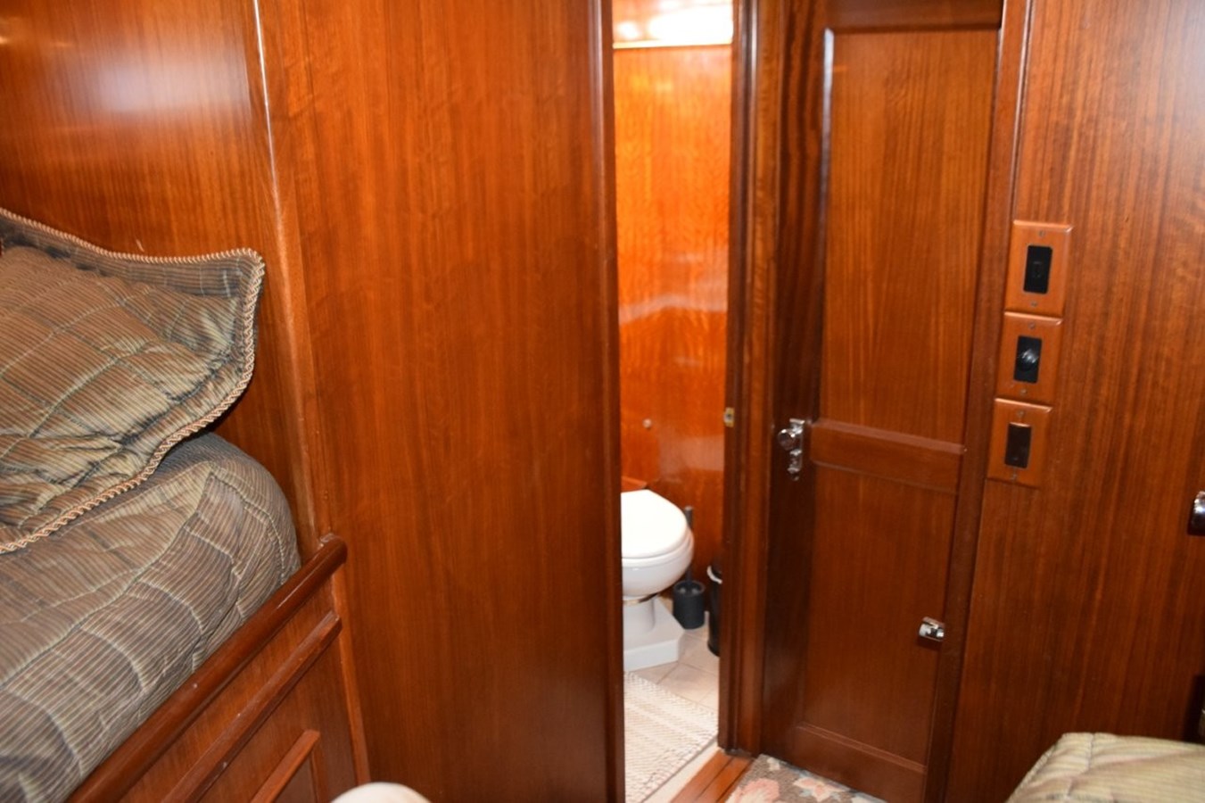 Guest stateroom private entry door to guest head, stateroom door closed