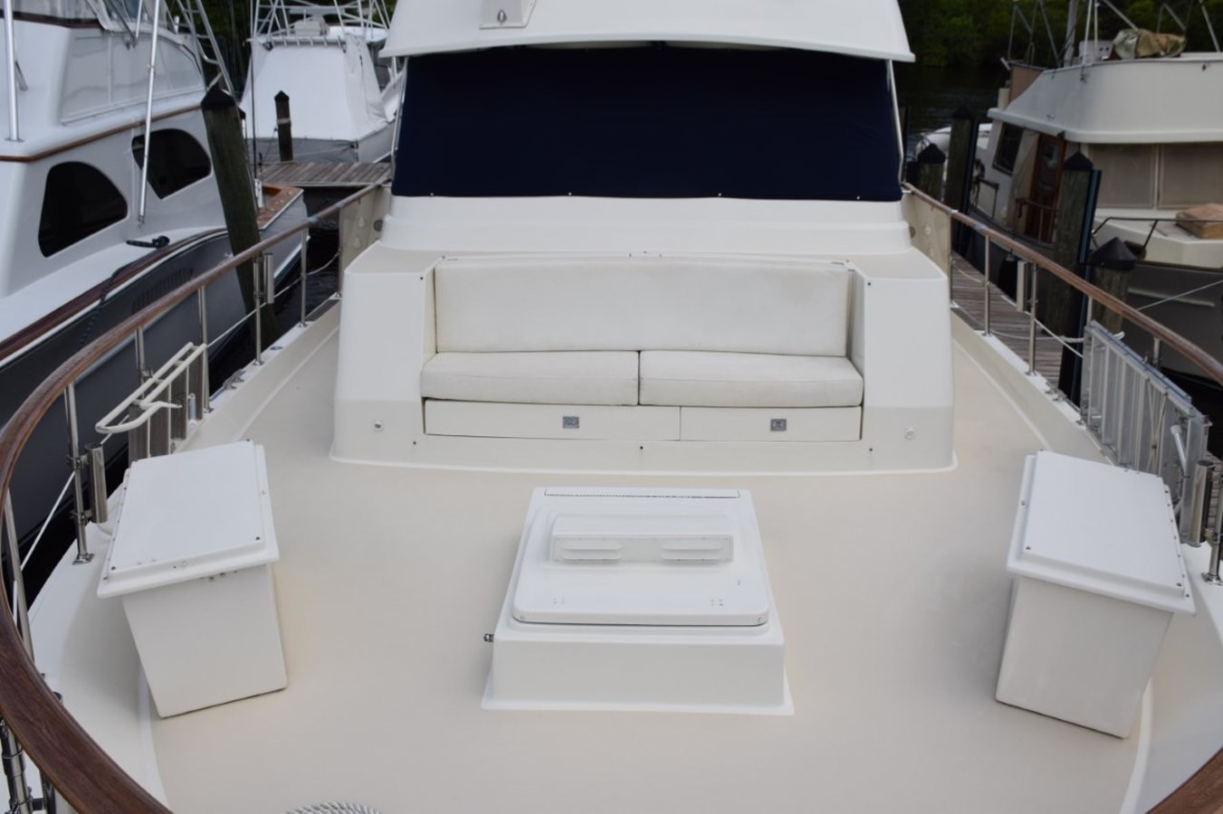 Foredeck lounge seat and two dunnage storage boxes which also have cushion tops