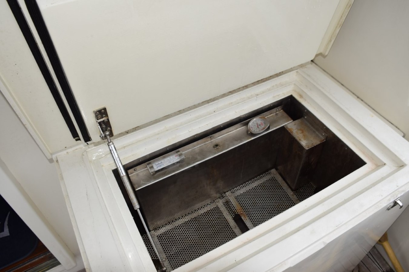 Stainless steel lined cockpit freezer
