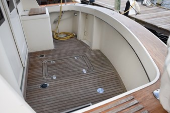 Teak cockpit sole and coverboards, boarding treads to either side, cockpit freezer, hatch to lazarette
