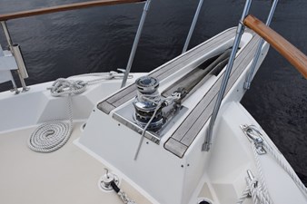 Hatteras pulpit and rebuilt Galley Maid hydraulic windlass.  Mounted plow anchor