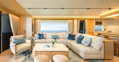 Horizon FD80 Hull 19 salon facing to port with sofa and table. 