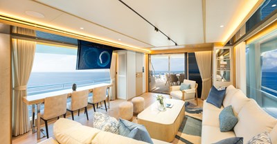 Horizon FD80 Hull 19 salon facing aft with large windows and TV.