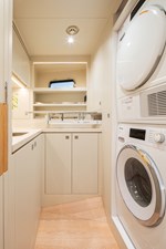 Horizon FD80 Hull full Laundry room with washer/dryer, storage, ironing board, and sink.