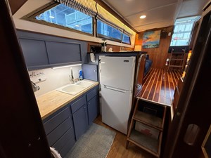 LANAI 6 Lanai galley with refrigerator, cabinetry and generous storage