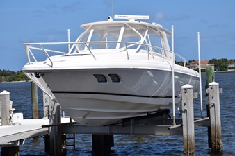 View of port side hull on the boat lift - Note bottom step and bow thruster