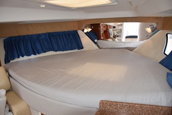 Forward berth area with curtain over hullside window