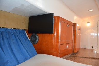 TV on adjustable wall mount and galley countretop