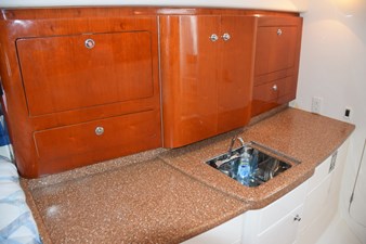 Galley cabinets with hideaway sink open